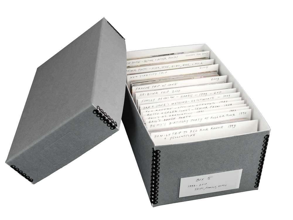 Gray acid-free metal edge box with card stock dividers storing and organizing 4 x 6 photographs