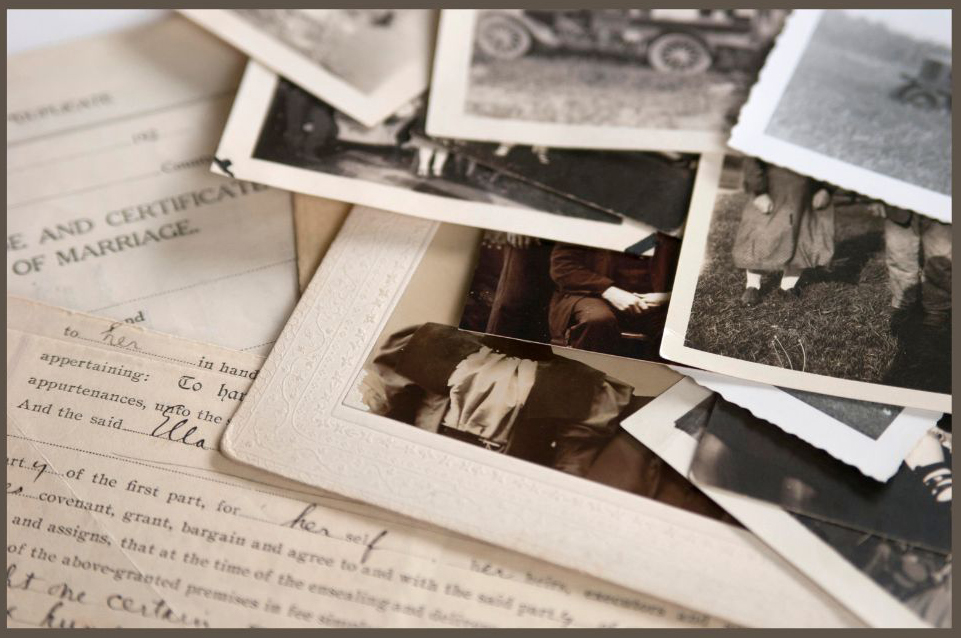 Sepia colored close up of scattered old photos and documents