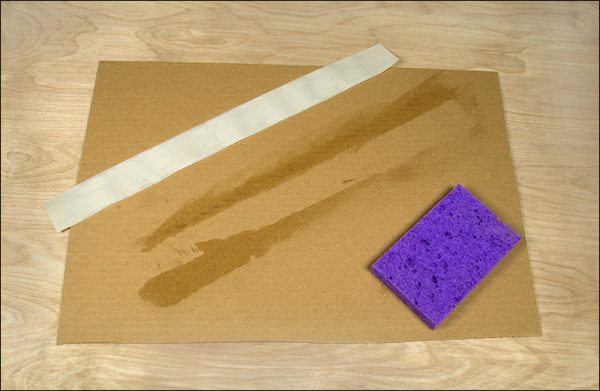 Moistening linen hinging tape with a sponge