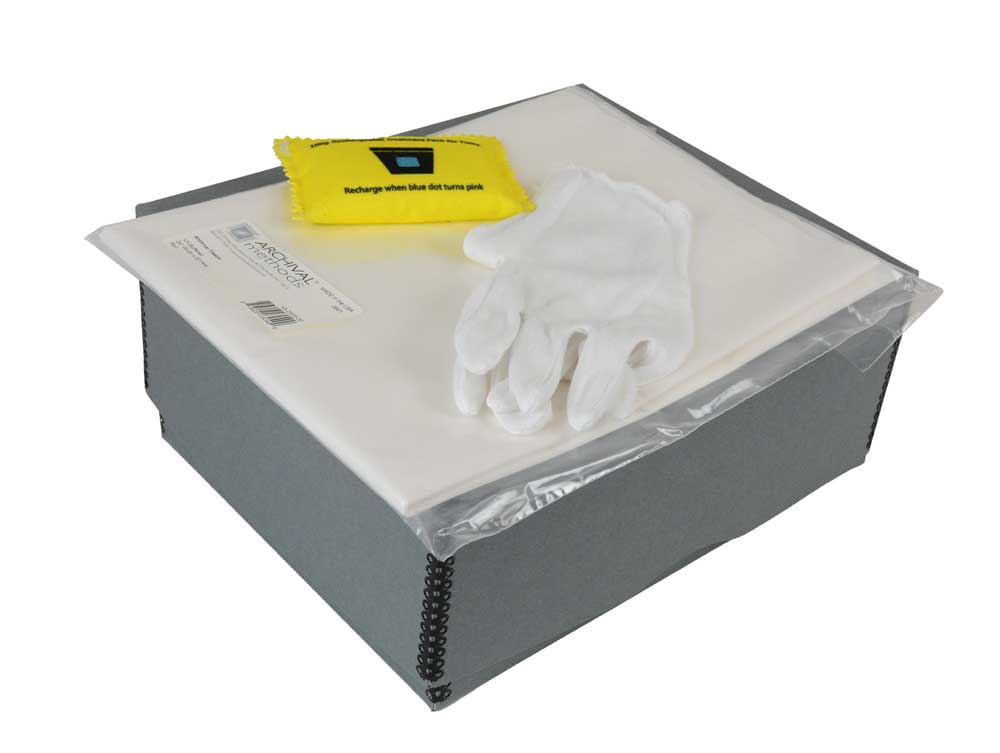 Textile Storage Kit with an acid-free box, tissue paper, cotton gloves, and desiccant for preserving quilts and delicate fabrics.