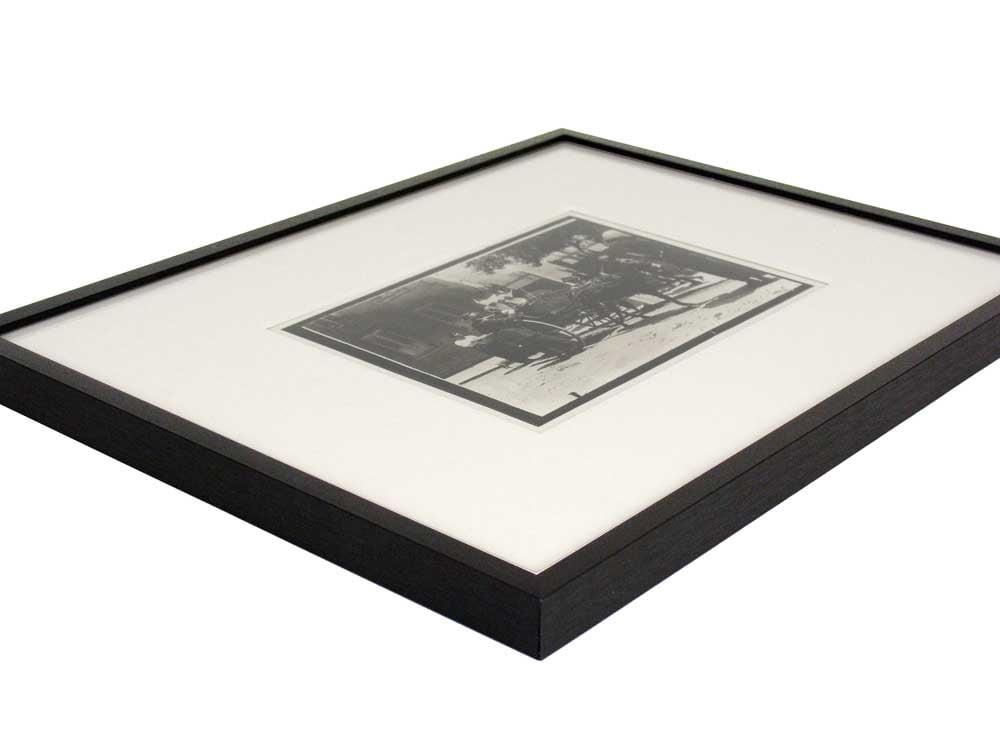 Matte black 11 x 14 Pre-Cut Profile 102 aluminum picture frame with archival mat and Lewis Hine Print.