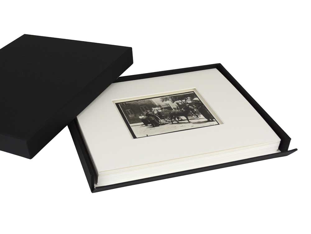Museum Drop Front Box with matted artwork in the archival storage box, made from acid-free materials with a drop-front design for accessing artwork. 