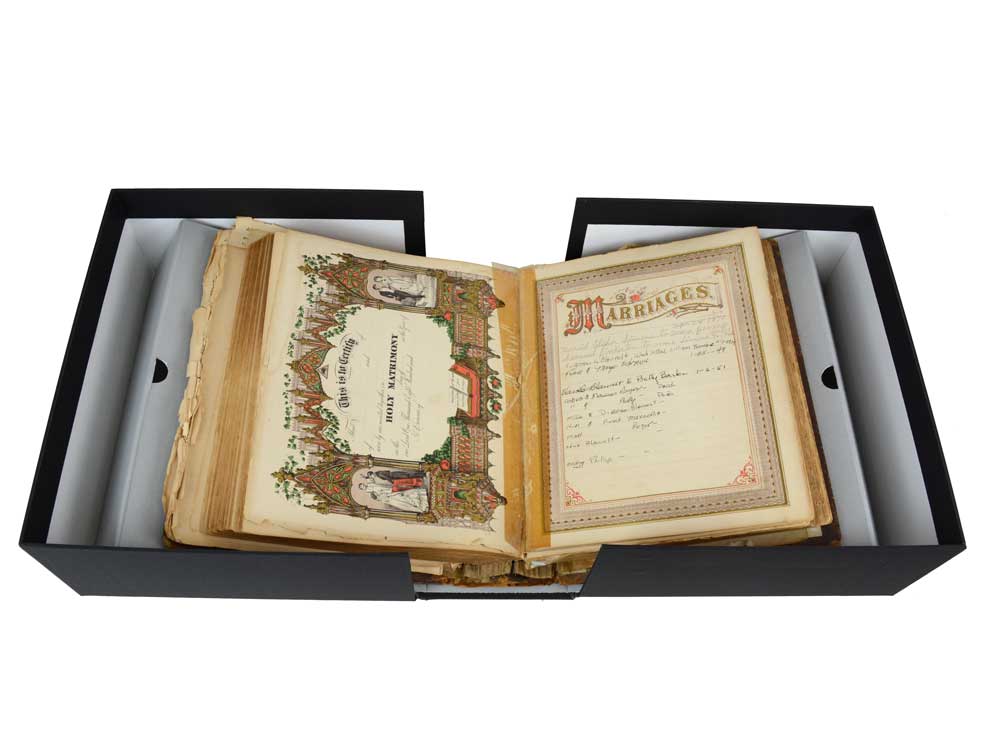 Rare Book Box with Cradle for fragile books, featuring a spine-supporting cradle holding an open bible in an archival box.