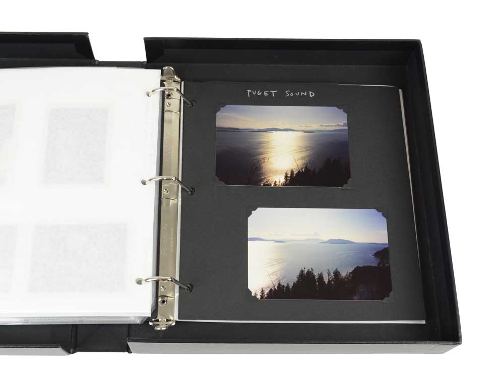 Black Acid-Free 3-Hole Mounting Pages with 2 photo in archival quality album. 