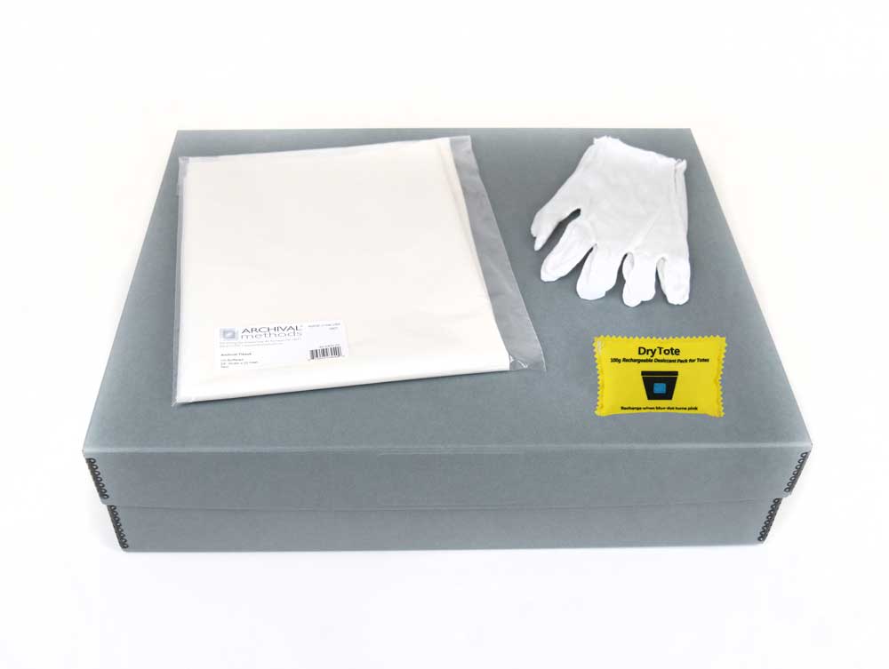 Textile Storage Kit with an acid-free box, tissue paper, cotton gloves, and desiccant for preserving quilts and delicate fabrics.