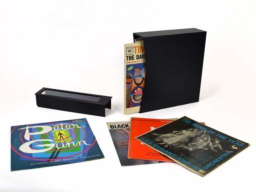Vinyl Record Storage Box for 12” records with LP record covers displayed with see-through protective covers. Box made of archival materials.