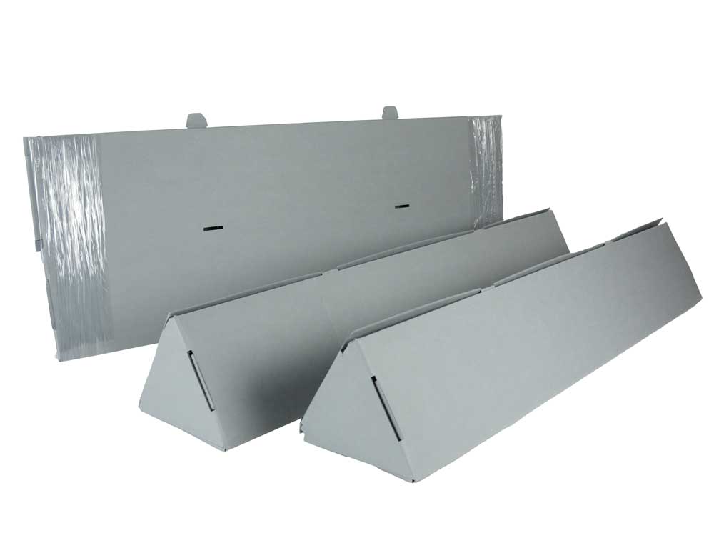Showing two Triangular Roll Storage boxes assembled and open flat, archival corrugated, ready for folding.
