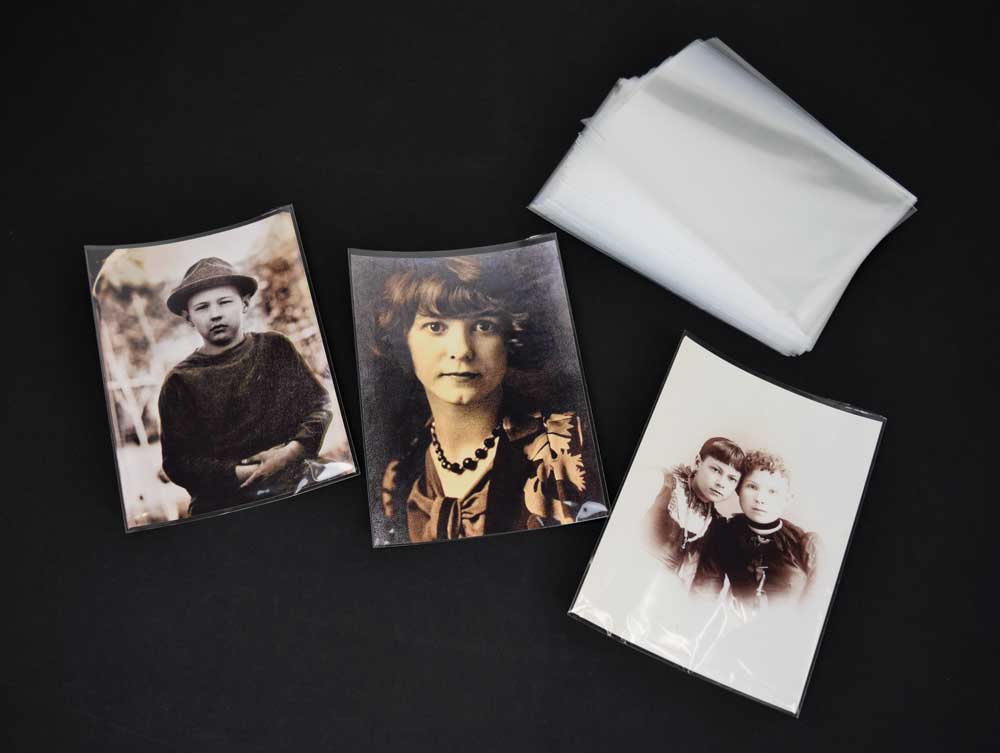 Acid-free 3-Sided Sleeves shown protecting a photo, offering archival storage of artwork, and photographs from handling damage.