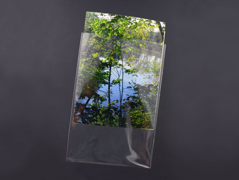 Acid-free 3-Sided Sleeves shown protecting a photo, offering archival storage of artwork, and photographs from handling damage.