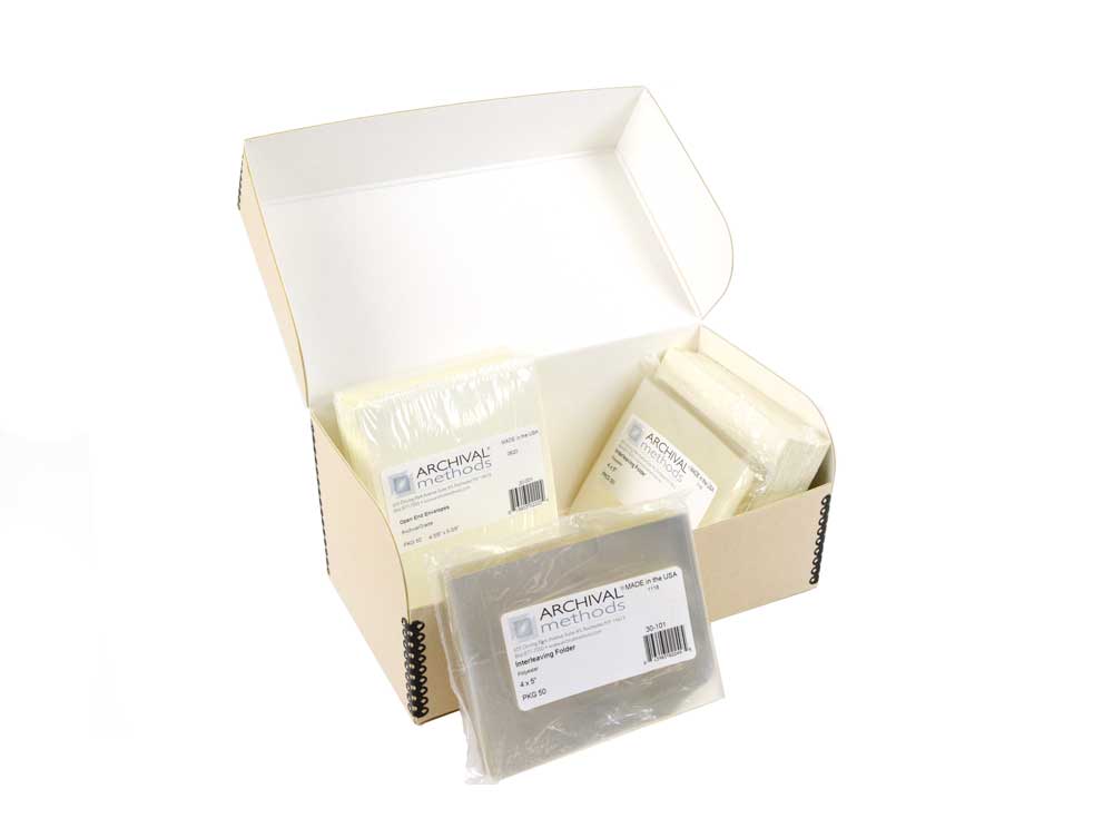 Archival Film Storage Kits featuring acid-free sleeves, sorting folders, and durable archival boxes for preserving 35mm negatives, 120 film, and 4x5 film.