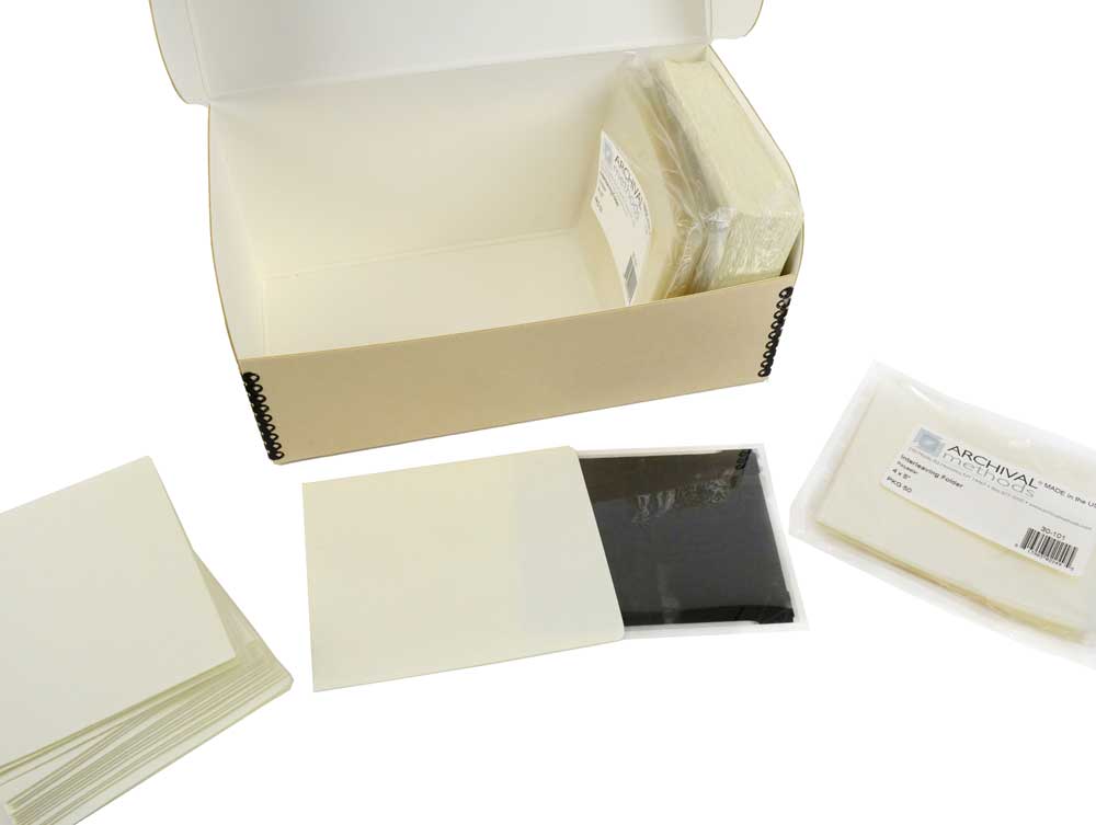 Archival Film Storage Kits featuring acid-free sleeves, sorting folders, and durable archival boxes for preserving 35mm negatives, 120 film, and 4x5 film.