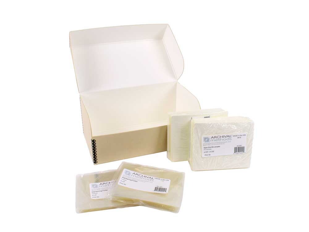 Archival Film Storage Kits featuring acid-free sleeves, sorting folders, and durable archival boxes for preserving 35mm negatives, 120 film, and 4x5 film.