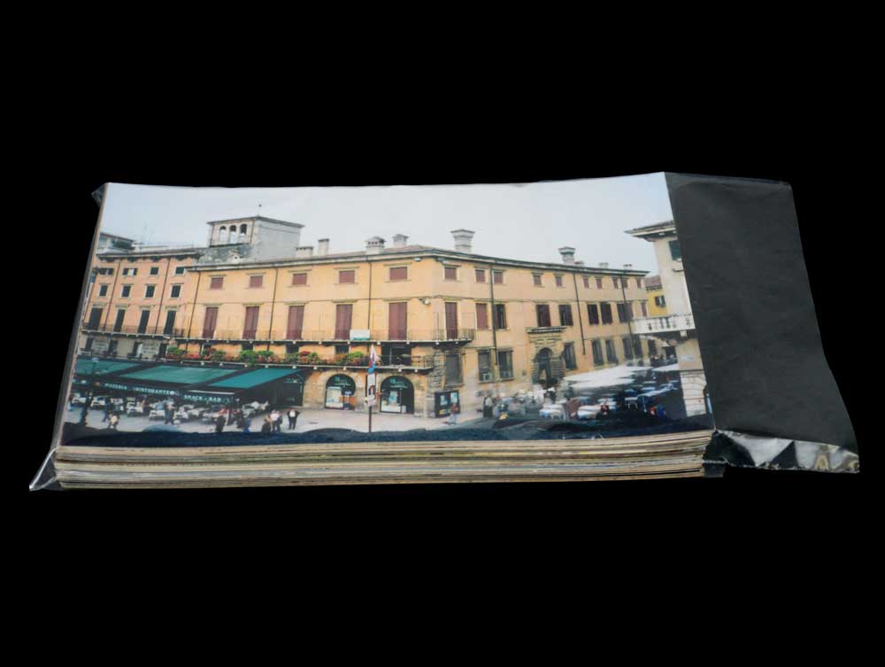 Polyethylene bag storing a stack of 4 x 6 photos