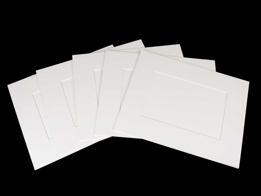 Enhance artwork with pre-cut exhibition mats, 4-ply, acid-free board, offering archival protection with beveled windows and 2-ply backing.