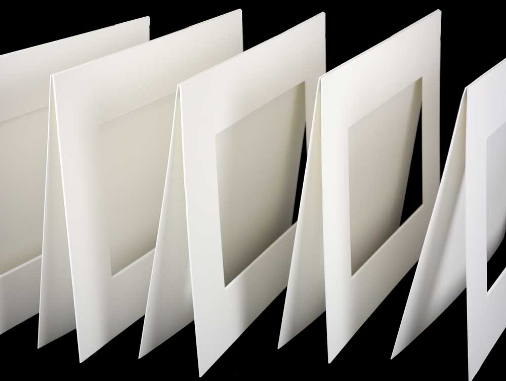 Enhance artwork with pre-cut exhibition mats, 4-ply, acid-free board, offering archival protection with beveled windows and 2-ply backing.