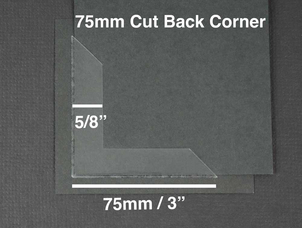 Acid-free archival mounting corners securely hold a photograph in place, ensuring safe display and preservation.