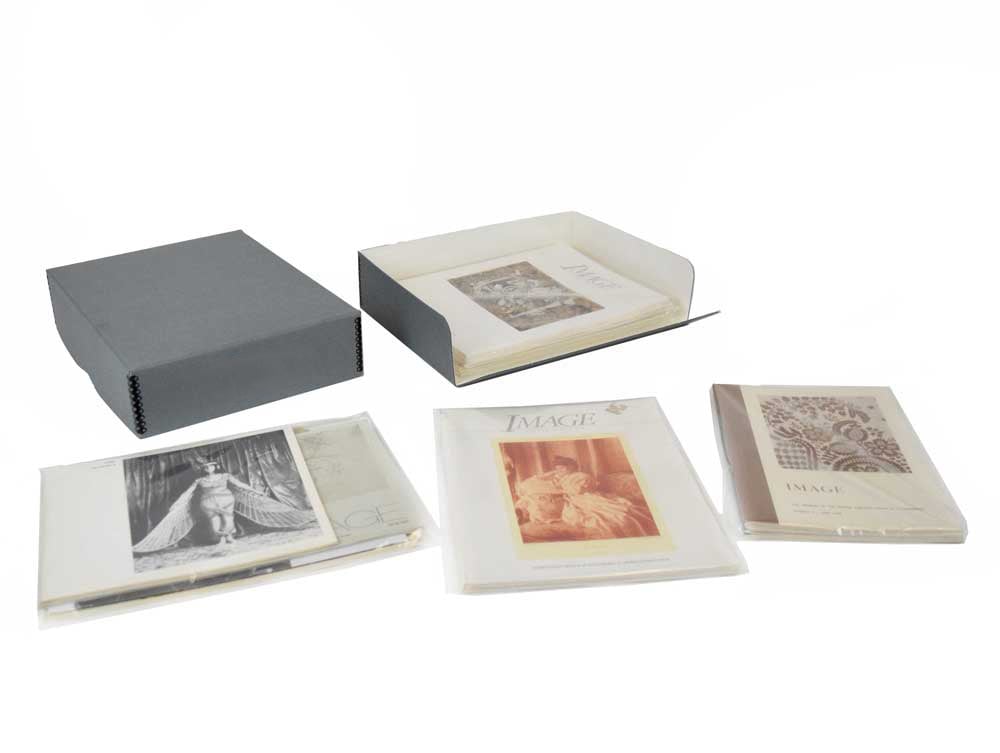 Gray Archival Newspaper & Magazine Storage Kit with acid-free storage box, polyethylene bags, and for long-term preservation.