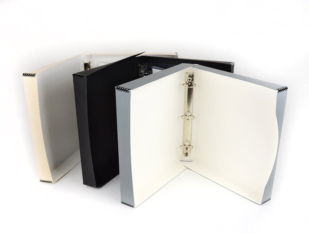 Binder-In-A-Box combines a 3-ring binder & box made from acid-free materials for preserving photos and documents. Showing: tan, black, gray. 