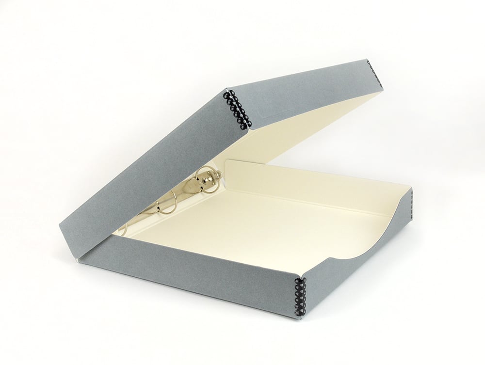 Open gray Binder-In-A-Box combines a 3-ring binder & box made from acid-free materials for preserving photos and documents.