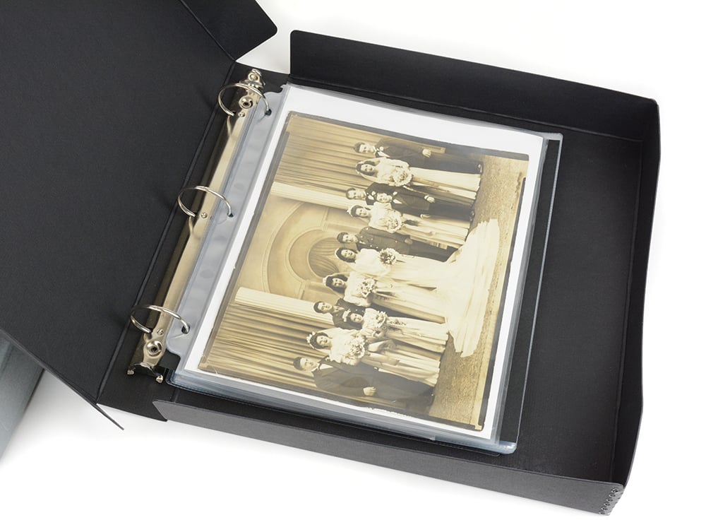 Open black Binder-In-A-Box combines a 3-ring binder & box made from acid-free materials for preserving photos and documents.