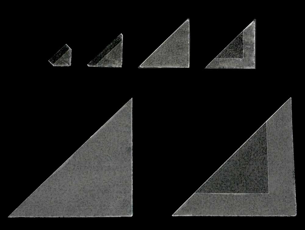 Photo demonstrating acid-free mounting corners securing photos in albums and mats for safe preservation.