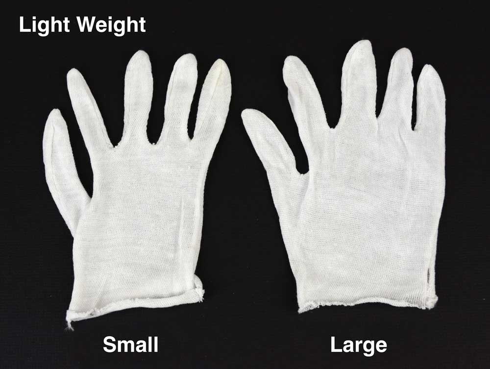 White cotton inspection gloves protect photographs and artifacts from oils and fingerprints during handling and archival care. 