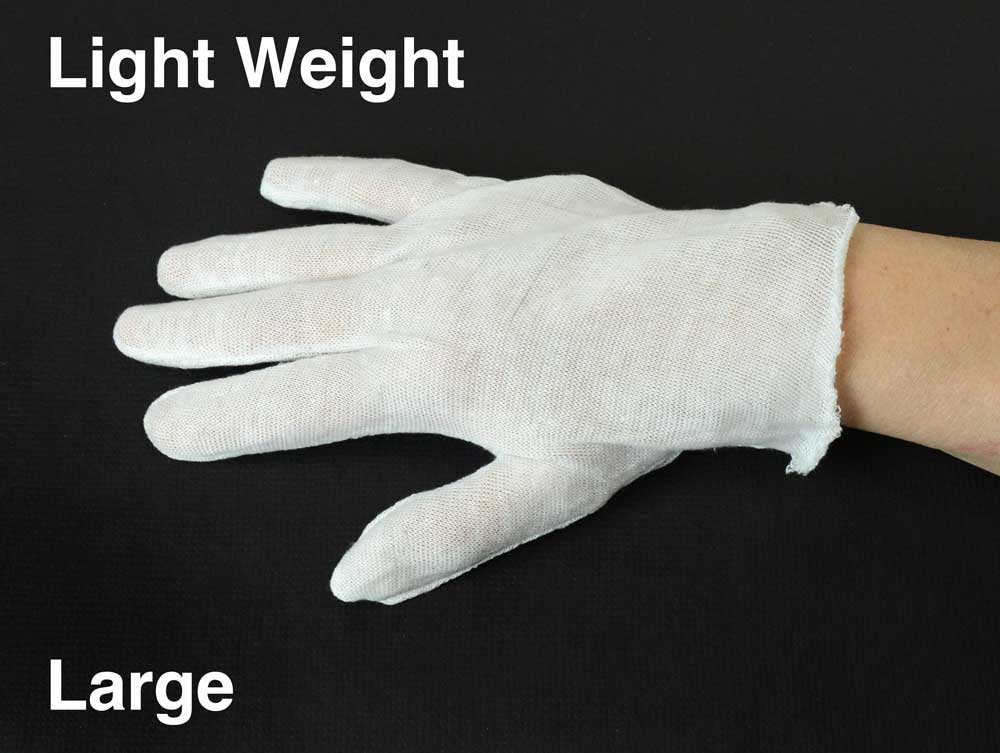 White cotton inspection gloves protect photographs and artifacts from oils and fingerprints during handling and archival care. 