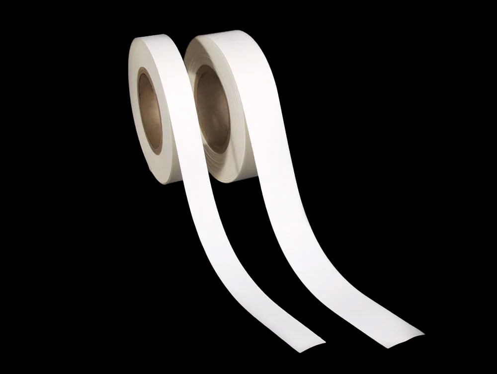 Rolls of one inch and one and a half inch acid-free linen tape showcasing its use for hinging window mats and bookbinding. 