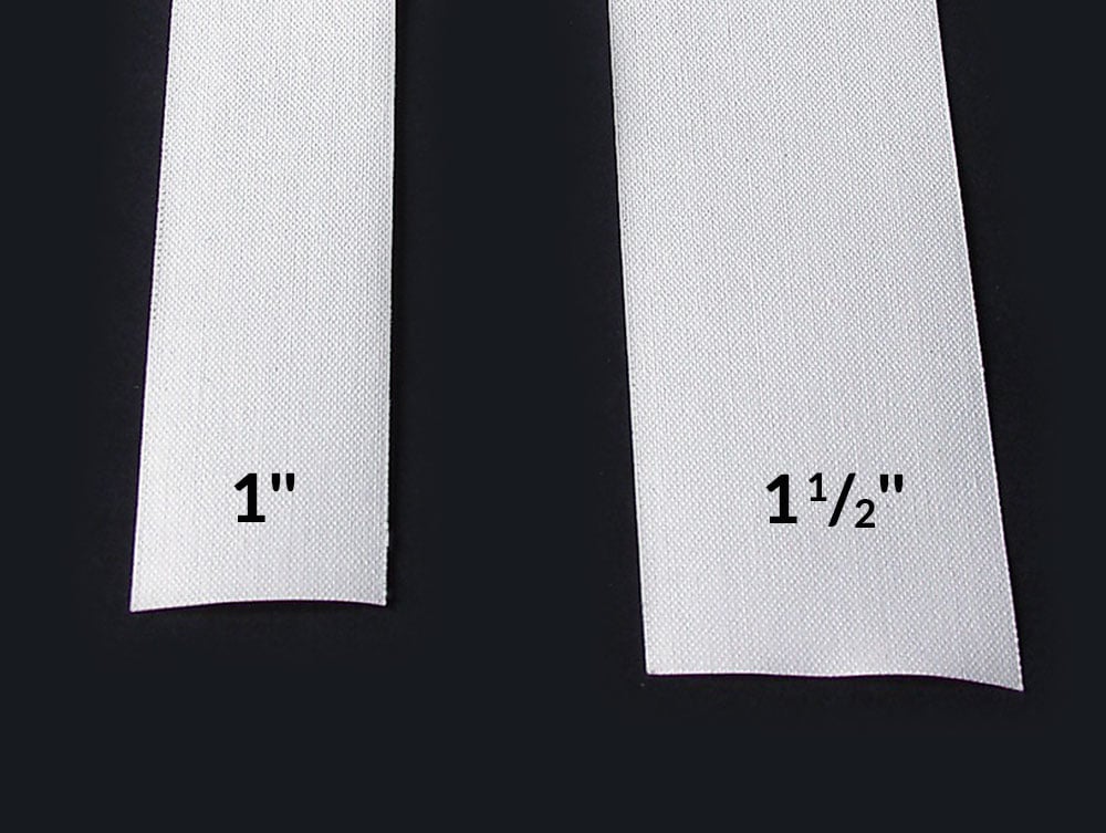 Close-up of one inch and one-half inch of acid-free linen tape showcasing their use for hinging window mats and bookbinding.