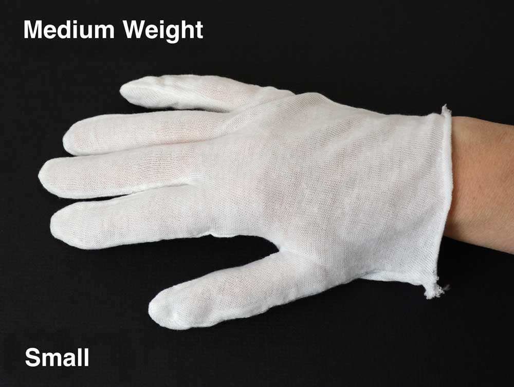 White cotton inspection gloves protect photographs and artifacts from oils and fingerprints during handling and archival care. 