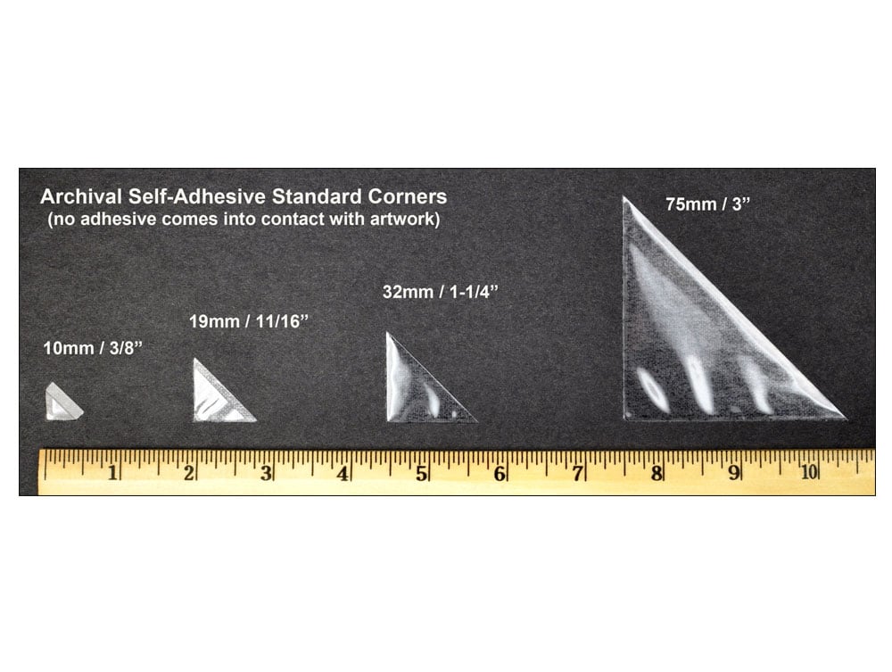Acid-free archival mounting corners securely hold a photograph in place, ensuring safe display and preservation.