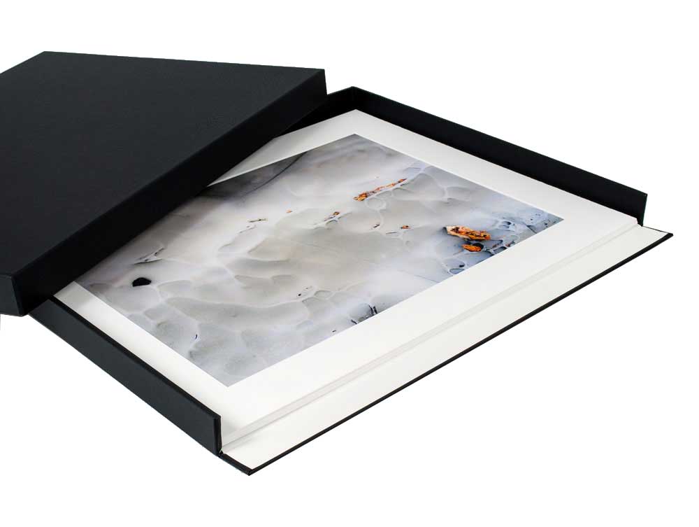 Museum Drop Front Box with matted artwork in the archival storage box, made from acid-free materials with a drop-front design for accessing artwork. 
