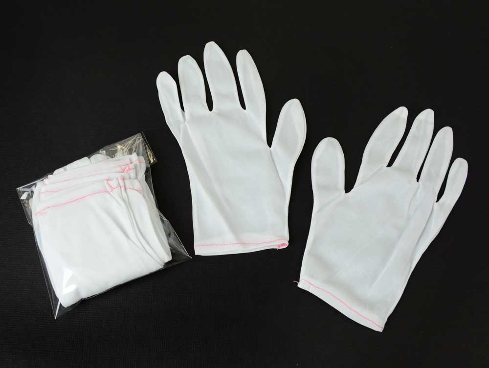 Nylon Lintless inspection gloves protecting documents and artifacts from fingerprints, ideal for delicate handling and archival care. 