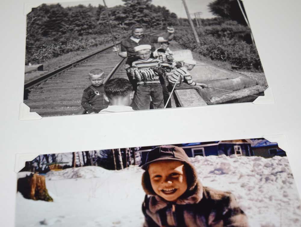 close up white Acid-Free 3-hole Mounting Pages with 2 photos in the archival-quality album.