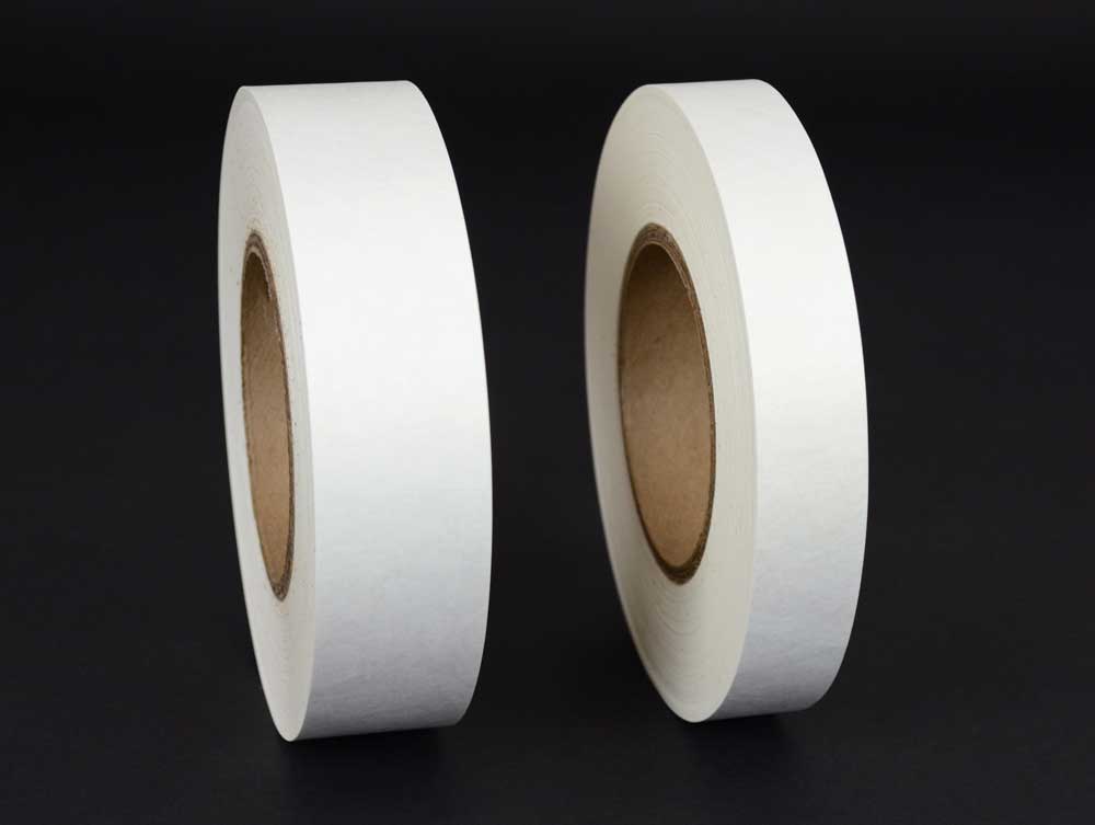 Rolls of one inch and one and a half inch acid-free Tyvek tape showcasing its use for hinging window mats and bookbinding. 