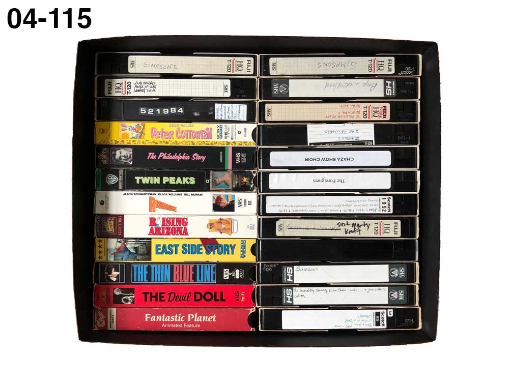 Black Short Top Box made from archival materials storing VHS-tapes. 