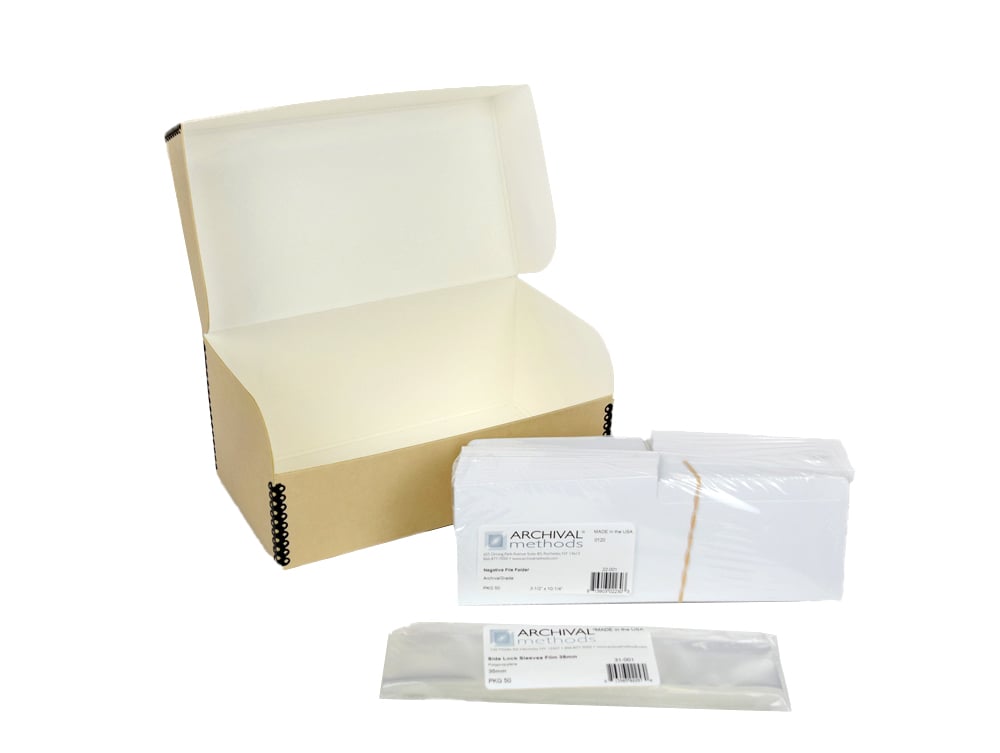 Archival Film Storage Kits featuring acid-free sleeves, sorting folders, and durable archival boxes for preserving 35mm negatives, 120 film, and 4x5 film.