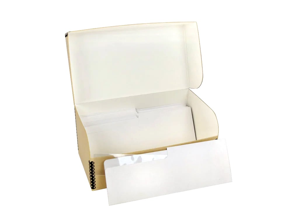 Archival Film Storage Kits featuring acid-free sleeves, sorting folders, and durable archival boxes for preserving 35mm negatives, 120 film, and 4x5 film.