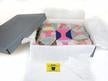 Textile Storage Kit with an acid-free box, tissue paper, cotton gloves, and desiccant for preserving quilts and delicate fabrics. thumbnail