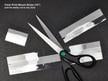 Archival-quality clear print mounting strips with self-adhesive backing, securely holding artwork in place without direct contact with adhesive.  thumbnail