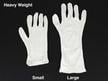 White cotton inspection gloves protect photographs and artifacts from oils and fingerprints during handling and archival care.  thumbnail