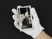 White cotton inspection gloves protect photographs and artifacts from oils and fingerprints during handling and archival care.  thumbnail